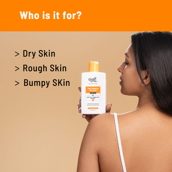 A woman holding the "Chemist At Play Daily Exfoliating Body Wash". The image specifies the product is suitable for dry skin, rough skin, and bumpy skin. The product is shown against an orange background.