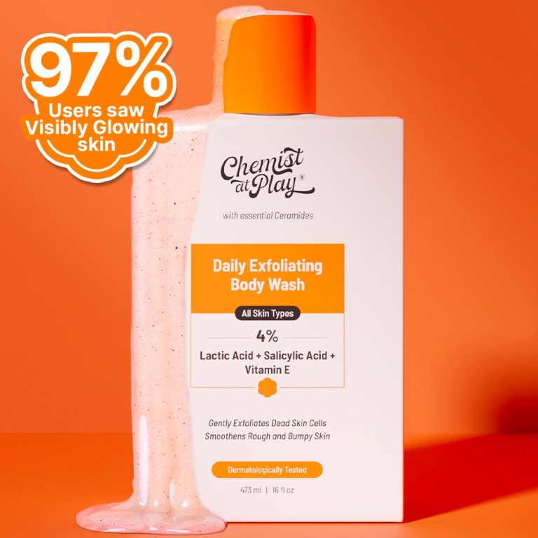 A bottle of "Chemist At Play Daily Exfoliating Body Wash" with a textured layer of the product spilling out of the bottle. The image highlights that 97% of users saw visibly glowing skin. The product is shown against an orange background.