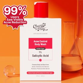 A bottle of "Chemist At Play Acne Control Body Wash" with a red cap, positioned against an orange background. The text highlights that 99% of users saw visible acne reduction. The product is shown alongside laboratory glassware to emphasize its scientific formulation.